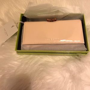 Brand new Ted Baker wallet tags attached.